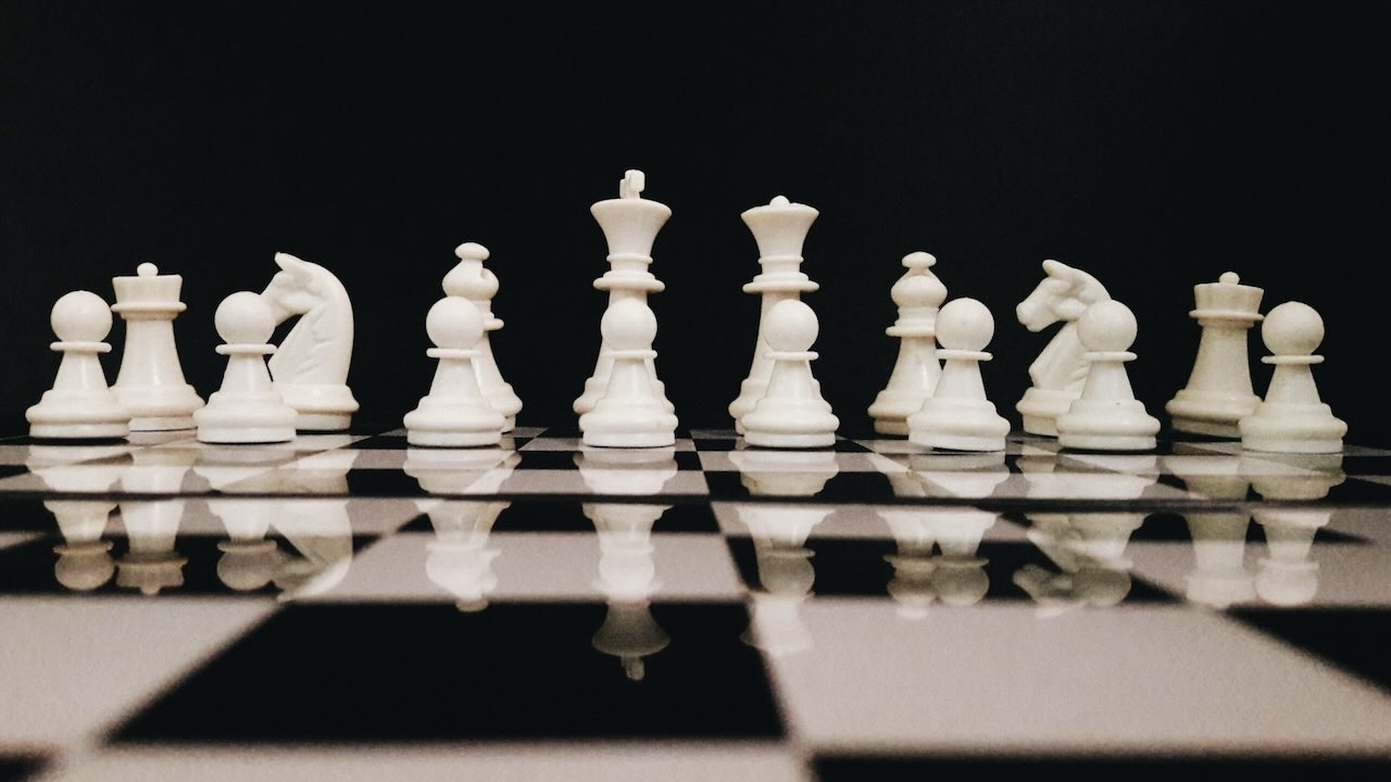 White chess pieces on a chess board