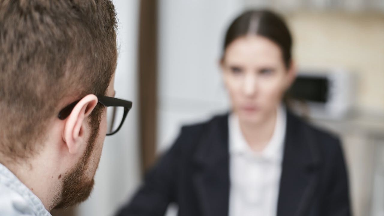 HR manager interviewing a candidate based on his change agility assessment test