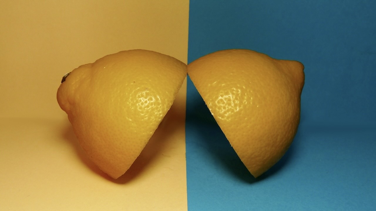 Two lemons next to each other with different coloured backgrounds comparing each to one another