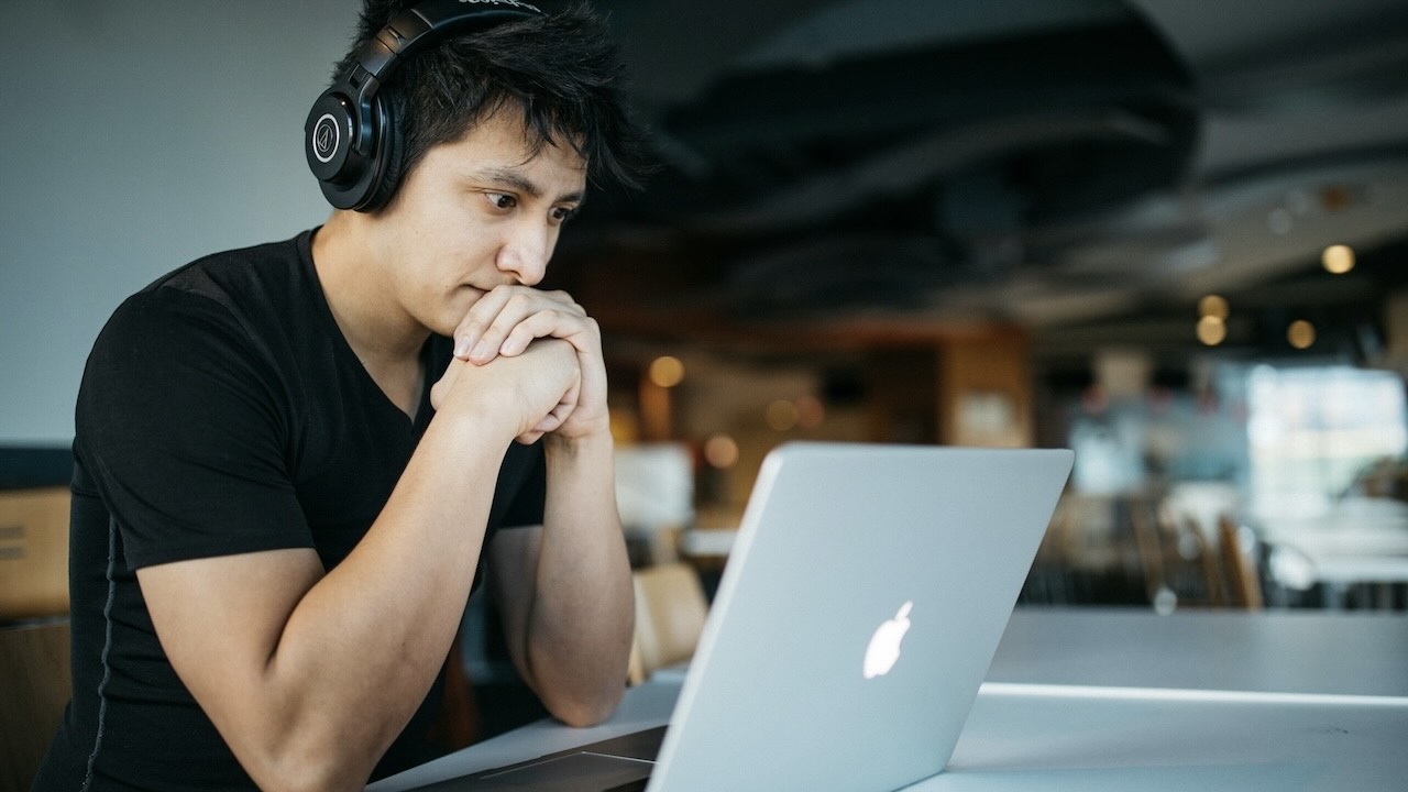Man studying something on his computer