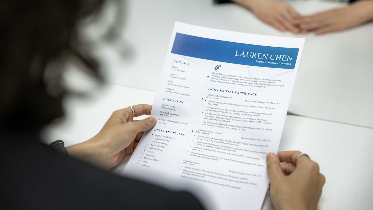 HR manager reviewing a candidates CV along with their Map Assessment report