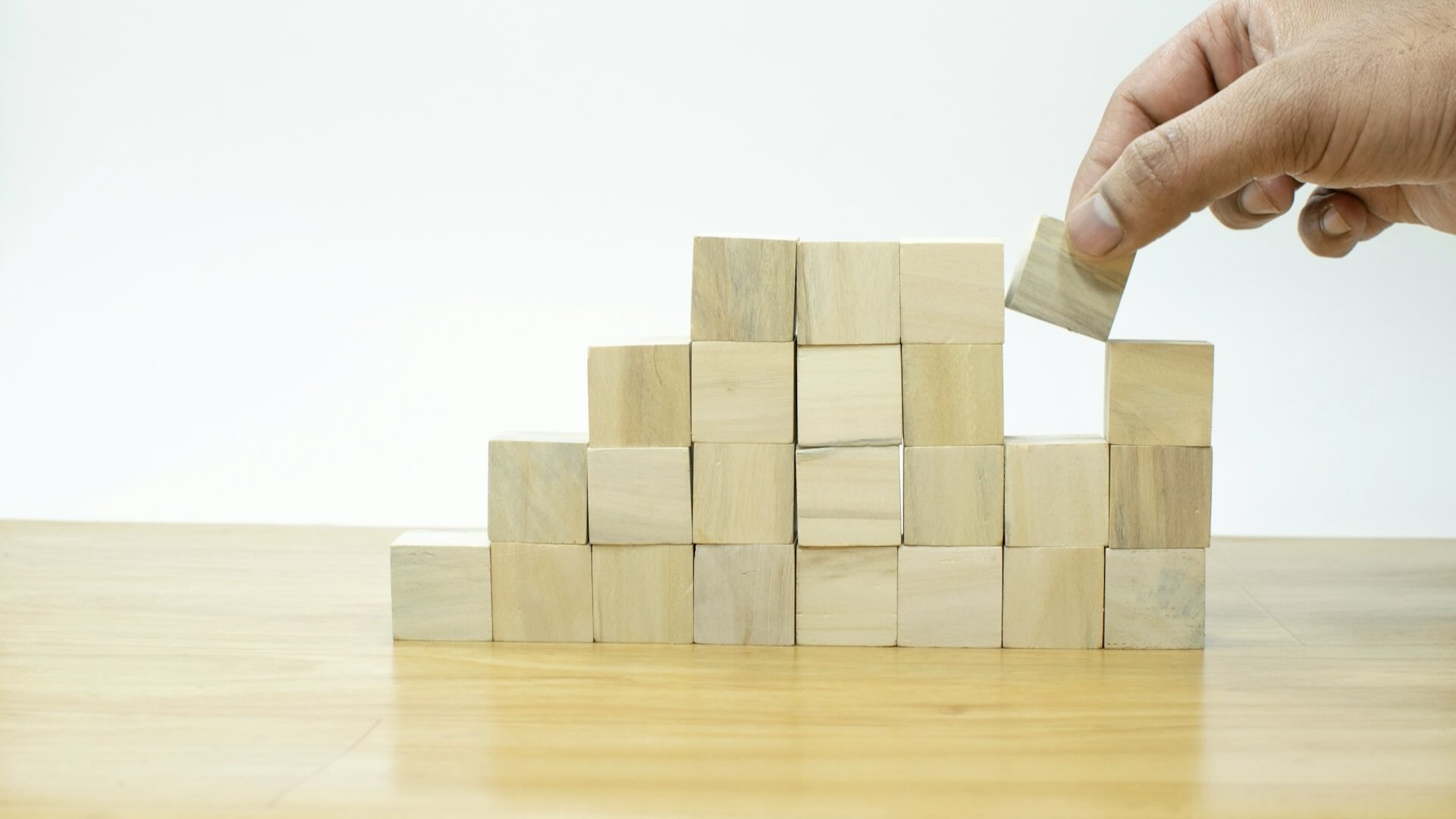 HR manager playing with building blocks on a table