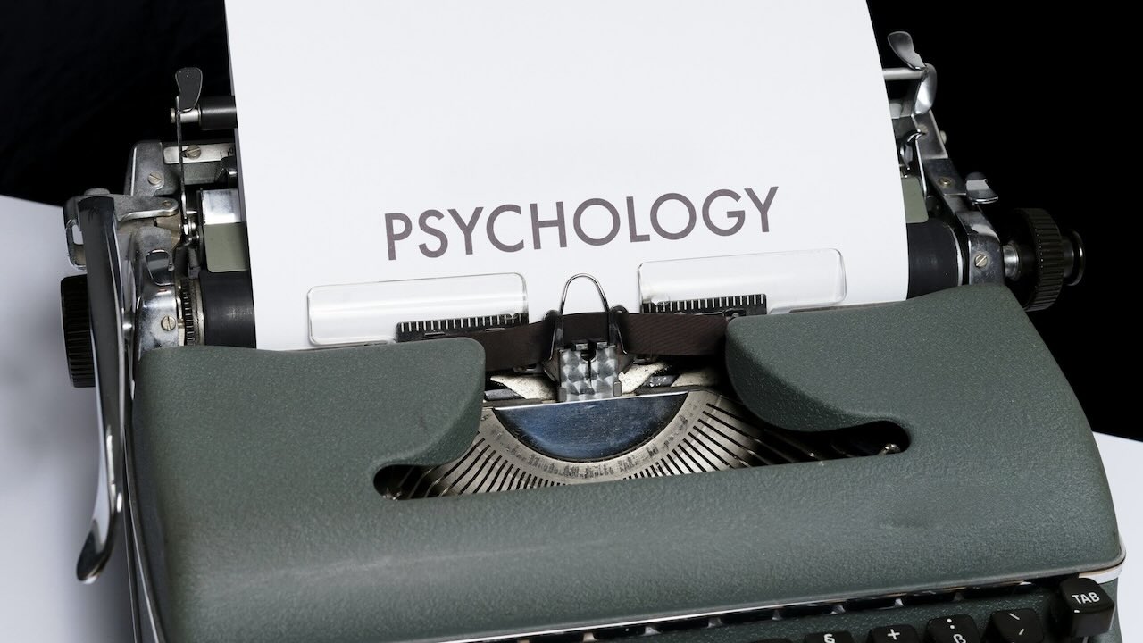 Typewritter with the words psychology written on a piece of paper highlighting what Matrigma measurures